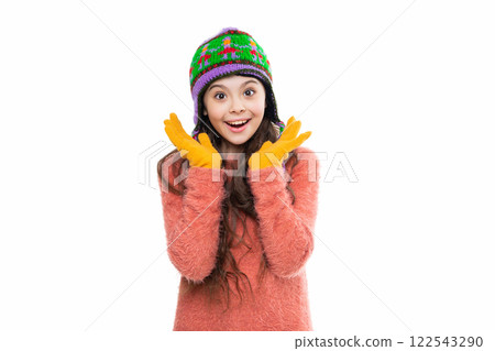 Girl in knitwear. Portrait of teen child wearing warm winter clothes. Girl kid wear hat isolated on white. Happy childhood. Teen girl in earflap hat. Winter fashion style. Chic winter accessories 122543290