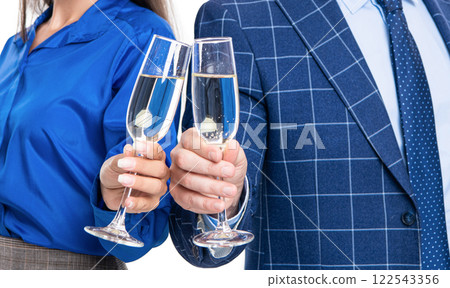 Celebrating their victory. Businesspeople drinking champagne socializing. Businesspeople making toast celebrating office party. Business partner attending event at convention center, closeup Celebrating their victory. Businesspeople drinking champagne socializing. Businesspeople making toast celebrating office party. Business partner attending event at convention center, closeup 122543356