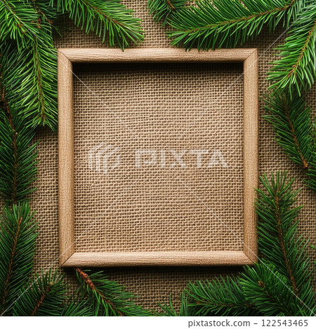 frame made of fir branches on a burlap background. Linen background. Eco-friendly homemade decor with copy space. 122543465