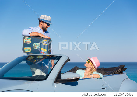 Happy couple in love travel by car by the sea 122543593