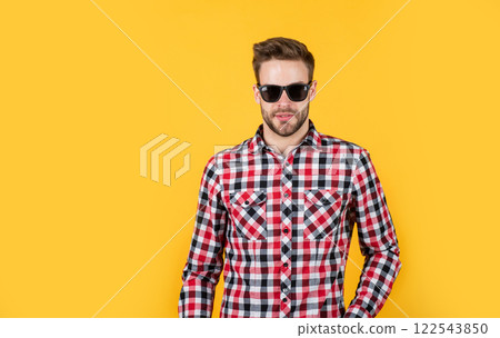 male with fashionable groomed hair and beard in glasses, look 122543850