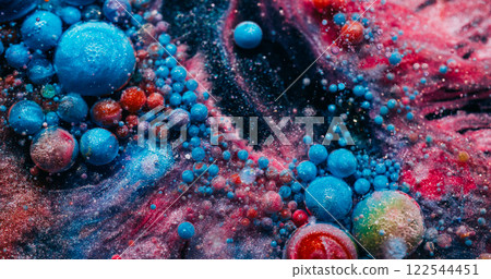 Colorful fizz. Soap paint. Round foam blue pink bubbles floating in shimmering dark water. Creative liquid particles abstract background. Colorful fizz. Soap paint. Round foam blue pink bubbles floating in shimmering dark water. Creative liquid particles abstract background. 122544451