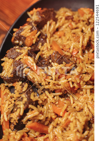 delicious pilaf with beef, beautiful food 122544691