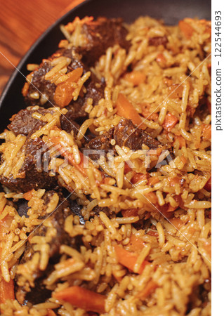 delicious pilaf with beef, beautiful food 122544693