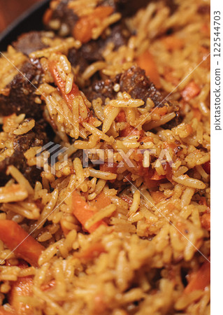 Pilaf in beautiful dishes is on the table in the Pilaf in beautiful dishes is on the table in the 122544703