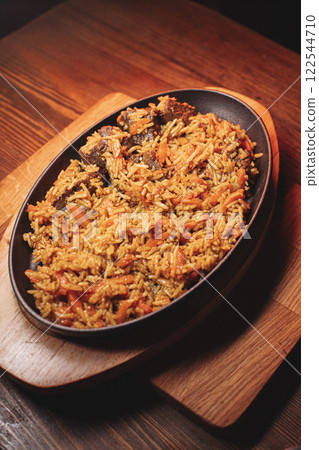 delicious pilaf with beef, beautiful food 122544710