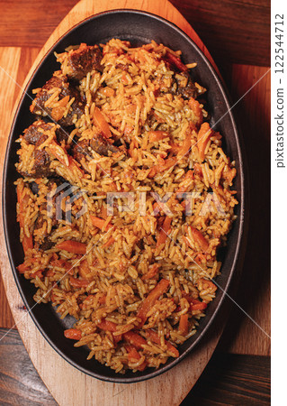 delicious pilaf with beef, beautiful food 122544712