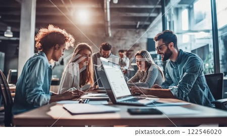 Team collaboration in a modern office setting. 122546020