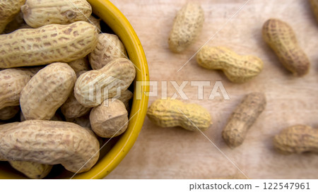 Peanuts in Bowl Top View Close-Up Flat Lay Shot on Wooden Background 122547961
