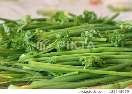 fresh herbs prepared for salads. Parsley and green onions. Proper nutrition, vitamins. 122548079