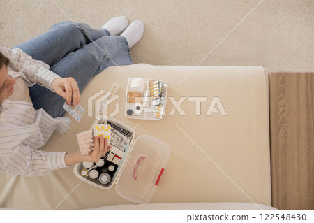 Female hands blister pills pack first kit aid storage organization. Vitamin, painkiller, cure supply 122548430