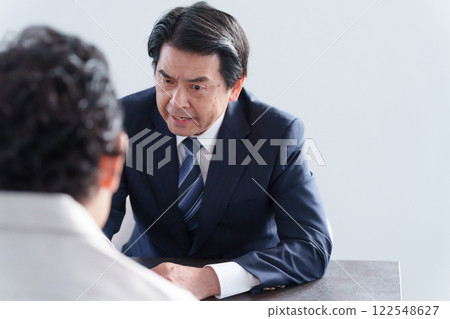 Angry businessman and man 122548627