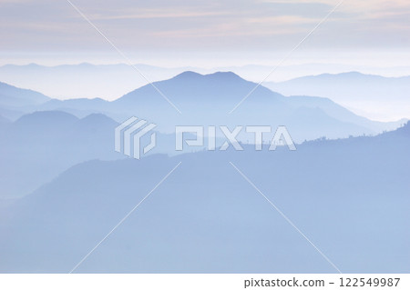 layers of mountains with fog 122549987