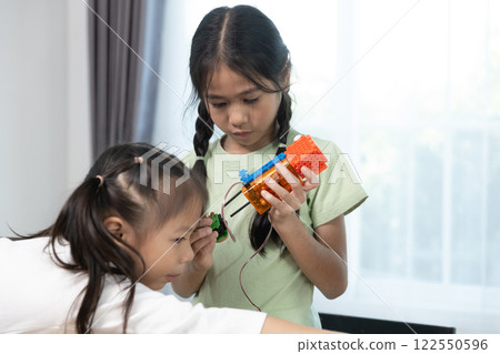Education STEM children student in classroom. Robot assembly training, brain development, Learning electrical future engineering. Education STEM children student in classroom. Robot assembly training, brain development, Learning electrical future engineering. 122550596