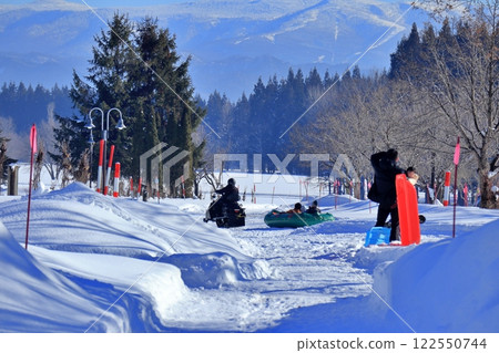 People sledding at Nordic Forest Park 122550744