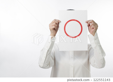 A person in a white shirt holding up a Maru card 122551143