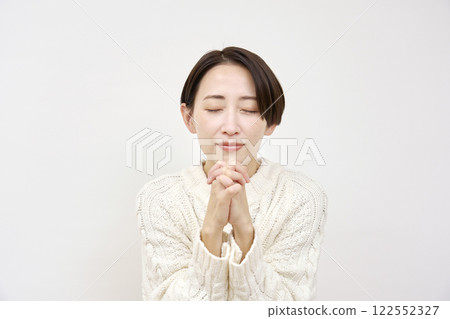 Pleading woman on white background 122552327