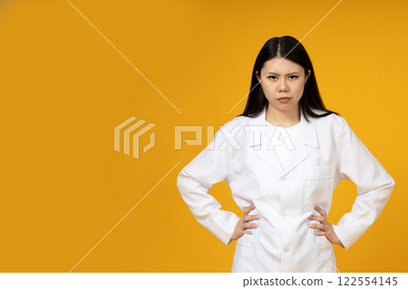A girl of Asian appearance in a doctor's uniform. A girl of Asian appearance in a doctor's uniform. 122554145
