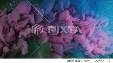 Color water flow. Ink smoke. Defocused pink green blue glowing splashes paint texture haze floating on purple shimmering abstract art light background. 122554224