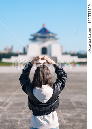 woman traveler visiting in Taiwan, female Tourist sightseeing at National Chiang Kai shek Memorial or Hall Freedom Square, Taipei City. Popular landmark and attractions. Asia Travel concept woman traveler visiting in Taiwan, female Tourist sightseeing at National Chiang Kai shek Memorial or Hall Freedom Square, Taipei City. Popular landmark and attractions. Asia Travel concept 122555139