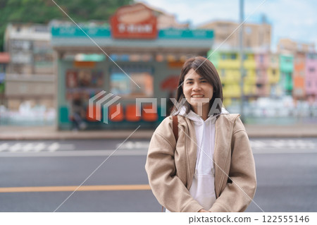 woman traveler visiting in Taiwan, female Tourist with backpack sightseeing at Keelung, Colorful Zhengbin Fishing Port. Popular landmarks and attractions near Taipei City. Asia Travel concept woman traveler visiting in Taiwan, female Tourist with backpack sightseeing at Keelung, Colorful Zhengbin Fishing Port. Popular landmarks and attractions near Taipei City. Asia Travel concept 122555146