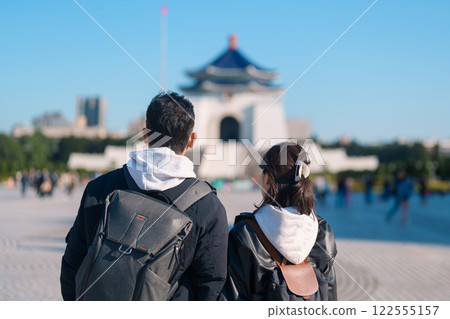 Couple traveler traveling in Taiwan, Tourists sightseeing at National Chiang Kai shek Memorial or Hall Freedom Square, Taipei City. Popular landmark and attractions. Asia Travel and vacation concept 122555157