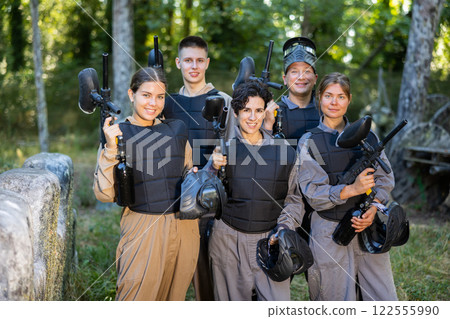 Group photo of cheerful male and female paintball players Group photo of cheerful male and female paintball players 122555990