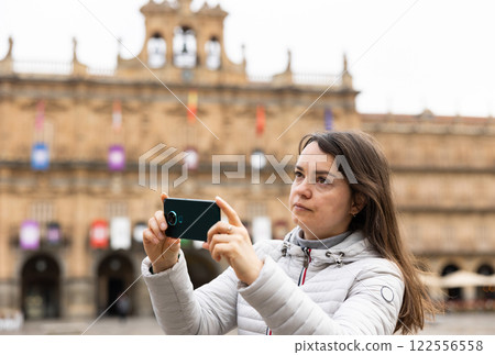 Woman tourist with phone, Salamanca, Spain 122556558