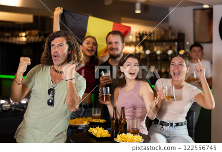 Group of fans in bar with Belgian flag Group of fans in bar with Belgian flag 122556745