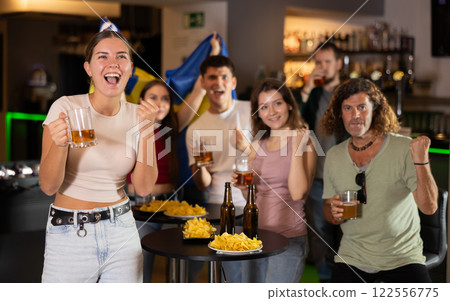 Group of fans in bar with Swedish flag Group of fans in bar with Swedish flag 122556775