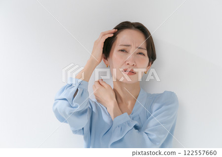 A woman in her 40s with short hair A woman in her 40s with short hair 122557660