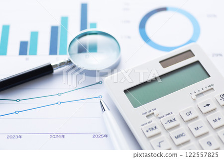 Business graph and loupe and calculator 122557825