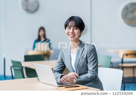 Businesswoman working in a cafe. Businesswoman working in a cafe. 122559204