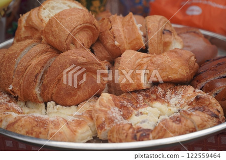 Dessert table on wedding with tasty cakes, cookies and sweets in pastel colors. Professional catering and servings. Festive atmosphere. 122559464