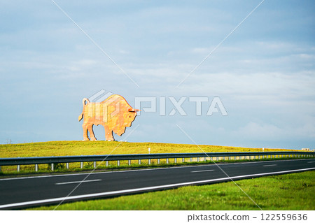 Belarus, August 2023: The symbol of Belovezhskaya Pushcha is a monument to a bison by the road Belarus, August 2023: The symbol of Belovezhskaya Pushcha is a monument to a bison by the road 122559636