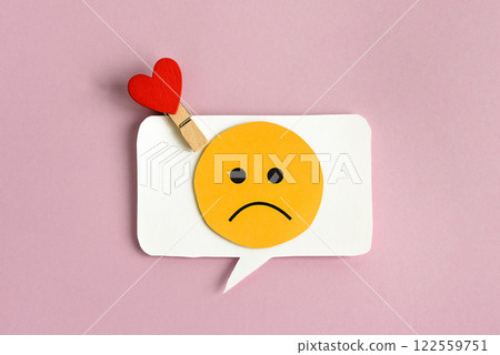 A bubble with a sad face inside and a heart is a symbol of unhappy love. A bubble with a sad face inside and a heart is a symbol of unhappy love. 122559751