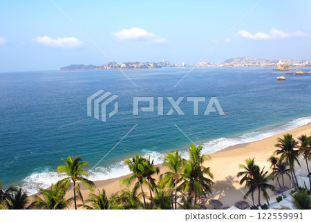 Beautiful aerial view of Acapulco Bay with sand beach, turquoise water and palm trees, Acapulco, Mexico. Top view on resort beaches and scenic Pacific ocean, Acapulco de Juarez, Mexico, North America Beautiful aerial view of Acapulco Bay with sand beach, turquoise water and palm trees, Acapulco, Mexico. Top view on resort beaches and scenic Pacific ocean, Acapulco de Juarez, Mexico, North America 122559991