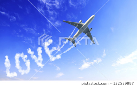 Blue sky with aircraft and Jet trailing smoke. Airplane drawing a word love in sky. Concept of love of travelling. Topic of summer vacation, travel, trip abroad on vacation, cruises and tours 122559997