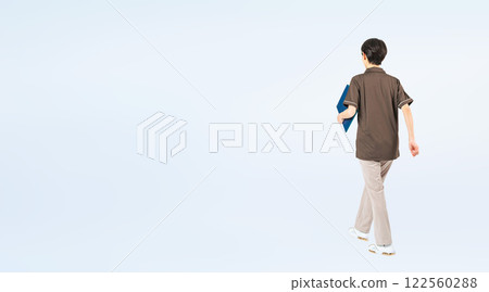 Full-body photo of a walking middle-aged female staff member Full-body photo of a walking middle-aged female staff member 122560288