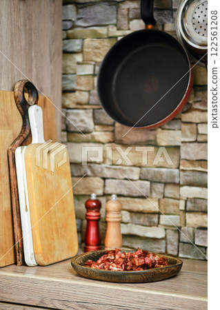 Cooking preparation with wooden cutting boards and ingredients in a rustic kitchen 122561208