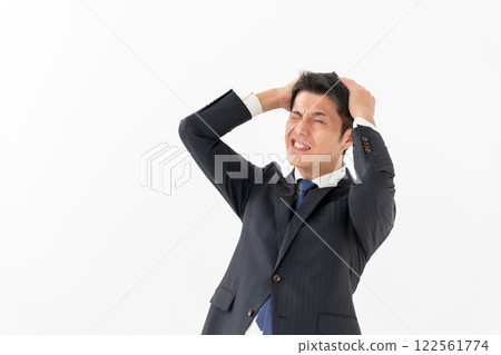 Businessman suffers 122561774