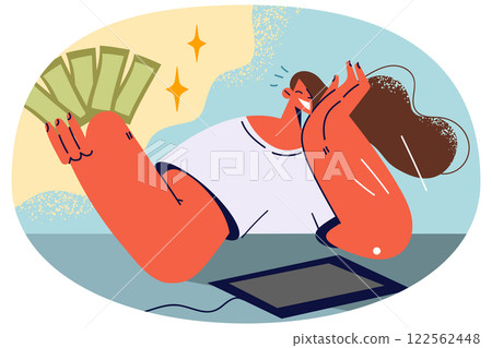 Smiling woman with money in hands work on laptop 122562448
