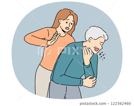Woman performs heimlich maneuver for choking old man who needs help due to airway obstruction 122562460