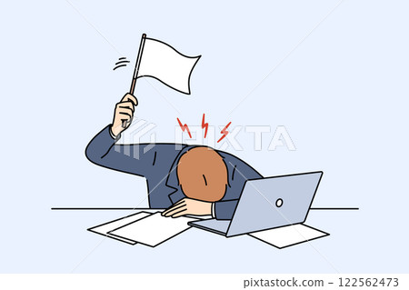 Stressed business man waving white flag after professional burnout, lying at workplace with laptop 122562473