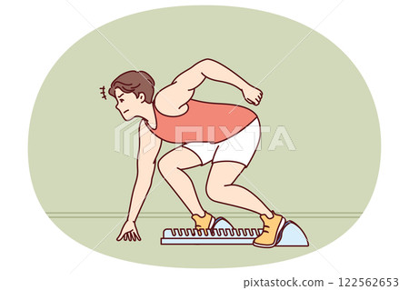 Man sprinter prepares for race at running standing in starting position in sports stadium Man sprinter prepares for race at running standing in starting position in sports stadium 122562653