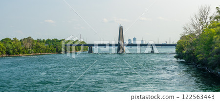 The Concorde Bridge ( Pont De la Concorde ) carries Avenue Pierre-Dupuy across the St. Lawrence River between Saint Helen's Island and Notre-Dame Island. Montreal, Quebec, Canada. The Concorde Bridge ( Pont De la Concorde ) carries Avenue Pierre-Dupuy across the St. Lawrence River between Saint Helen's Island and Notre-Dame Island. Montreal, Quebec, Canada. 122563443