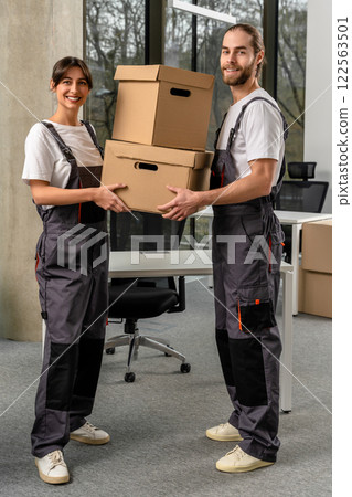 Young people working together with sorting the parcel in a packaging office 122563501