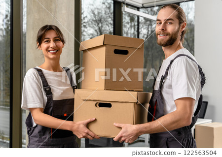 Young people working together with sorting the parcel in a packaging office 122563504