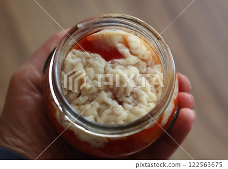 Mould and fungus on homemade canned tomato and pepper salsa sauce. 122563675