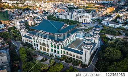 Aerial view of a large building in the city surrounded by trees Aerial view of a large building in the city surrounded by trees 122563983